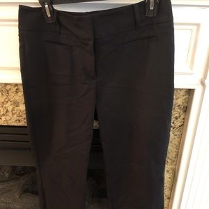 Women’s black work slacks.